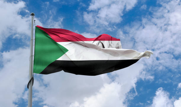 istock Sudan flag - realistic waving fabric flag. 1347666365