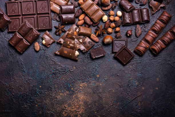 istock Pieces of broken milk and dark chocolate bars 1347666625