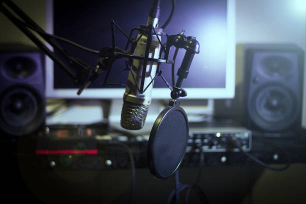 istock Announcer microphone on recording studio background. No people 1347668571