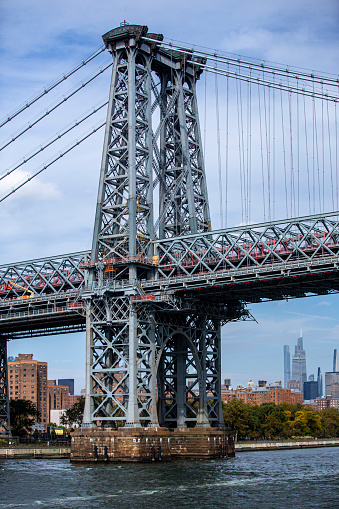 A view of Williamsburg Bridge from the East River in New York City