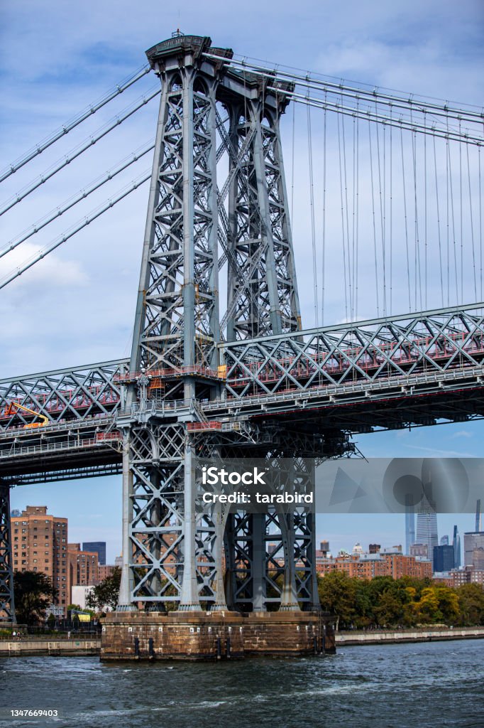 A view of Williamsburg Bridge from the East River in New York City Brooklyn - New York Stock Photo