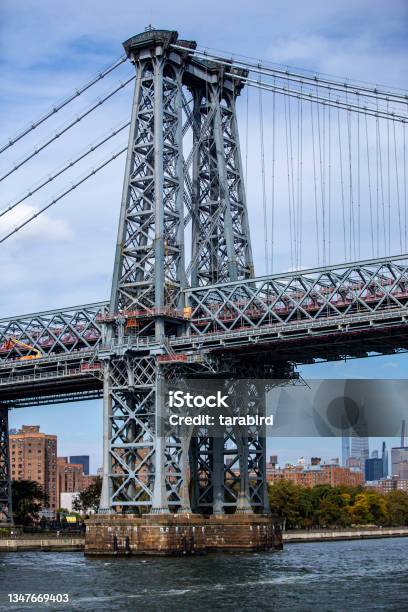 A View Of Williamsburg Bridge From The East River In New York City Stock Photo - Download Image Now
