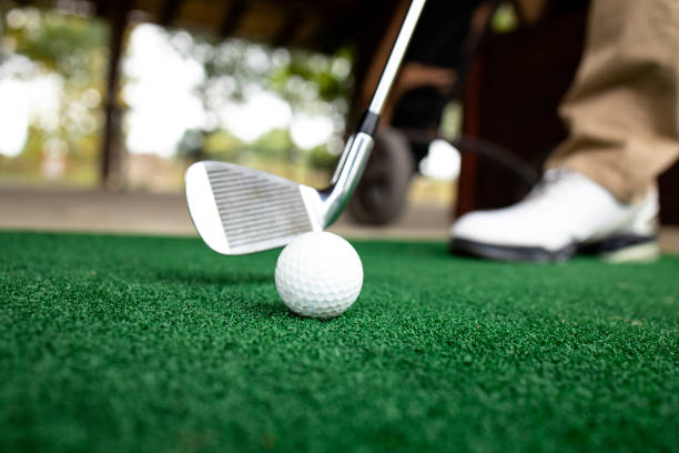 istock Golfer preparing to hit the ball at golf course. 1347671172