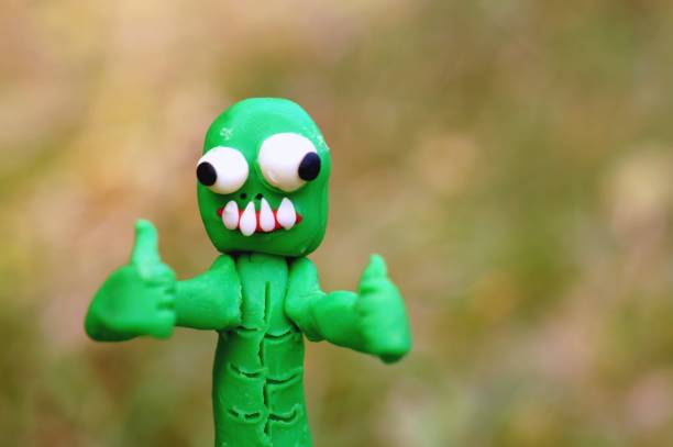 istock Happy zombie with two fingers raised up. 1347672402
