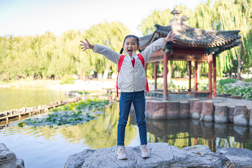 Little girl in classical chinese garden