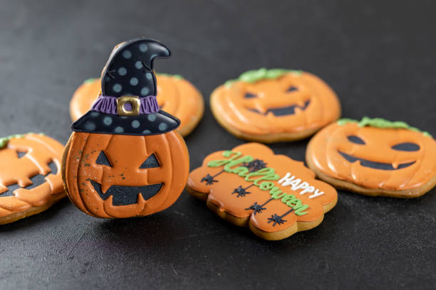 istock Bright Halloween gingerbread cookies on a black background 1347674942