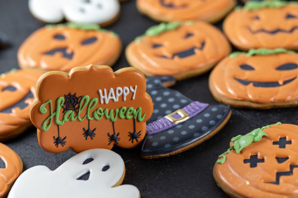 istock Bright Halloween gingerbread cookies on a black background 1347674984