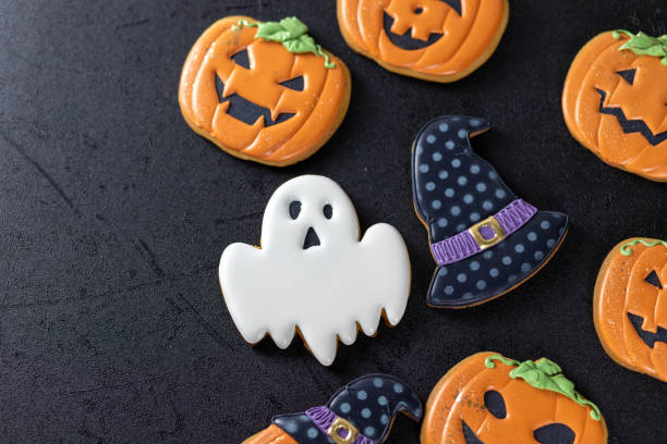 istock Bright Halloween gingerbread cookies on a black background 1347675066