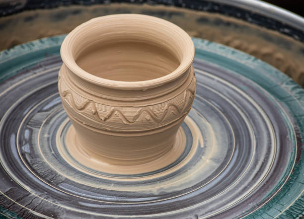 istock Master class on modeling of clay on a potter's wheel In the pottery workshop 1347676503