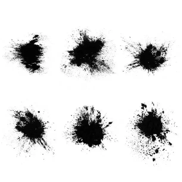 Photo of set of black splashes with splashes isolated on white background