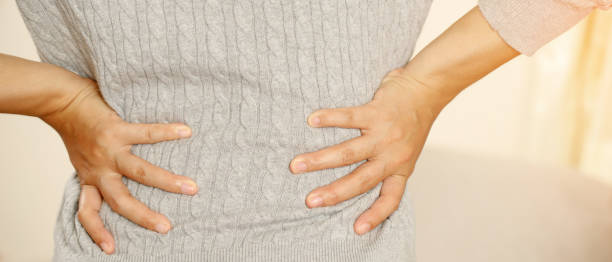 istock Lower back pain is usually caused by a muscle injury. broken pillow 1347678274