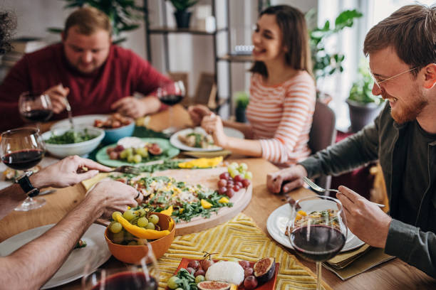 istock Friends eating together 1347679996