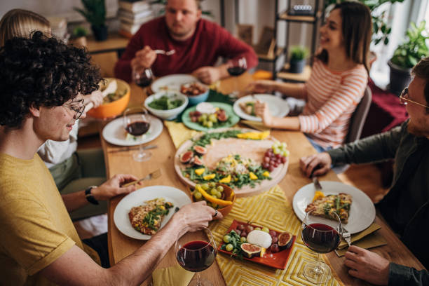 istock Friends eating together 1347680018