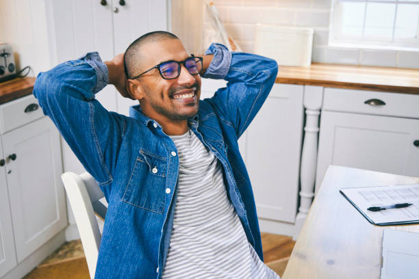 istock Shot of a young man taking a break while working at home 1347680780