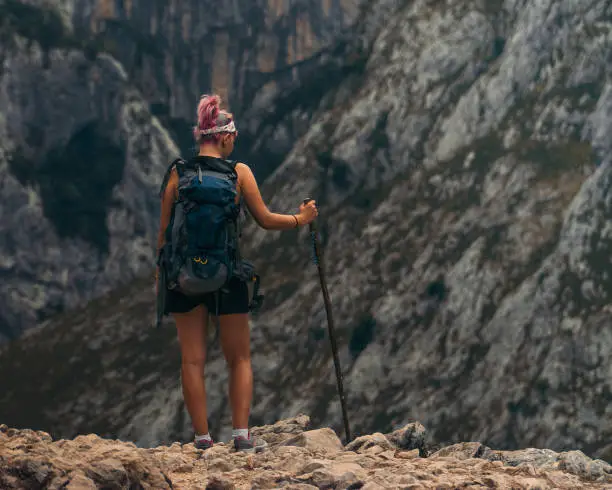 Photo of woman looking for tranquility and solitude in the mountains