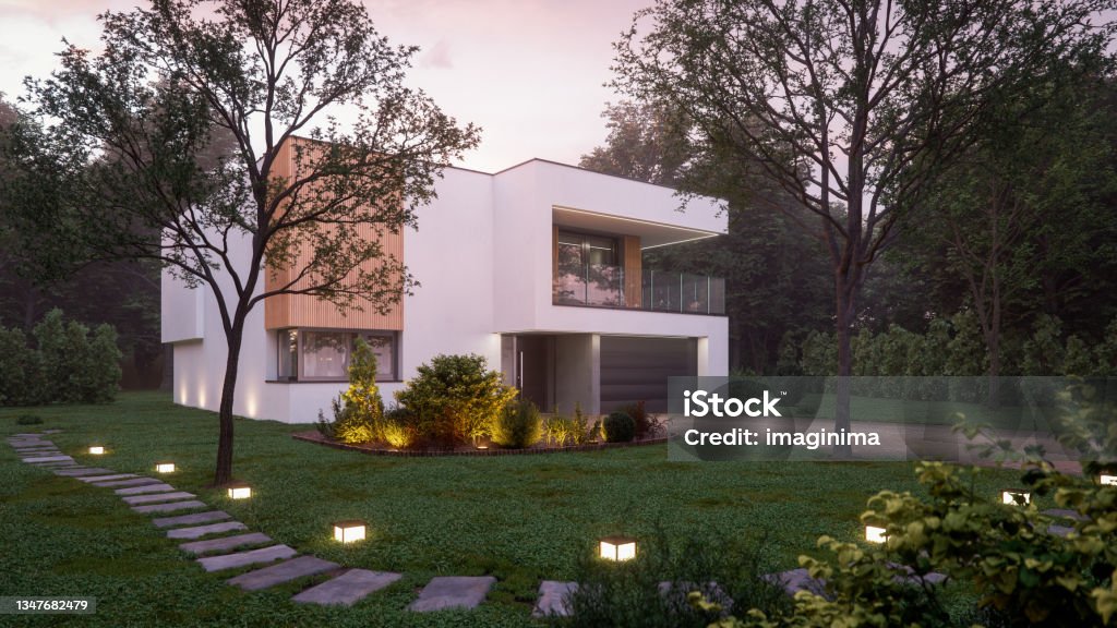 Luxury Modern House In Forest At Dawn Luxury modern villa in the forest at dawn. House Stock Photo