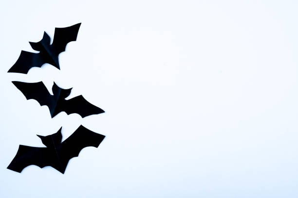 istock Halloween white background with black bats. View from above. Holiday decorations concept. Copy space, top view, flat lay. 1347682521