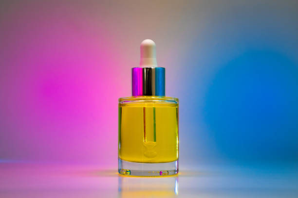 istock Yellow face oil on light pink and blue background 1347682799