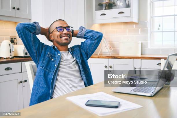 Shot Of A Young Man Taking A Break While Working At Home Stock Photo - Download Image Now