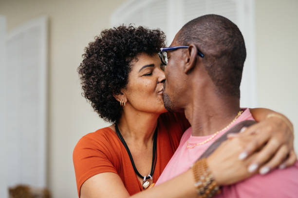 istock Couple hugging in front of their new home 1347684706