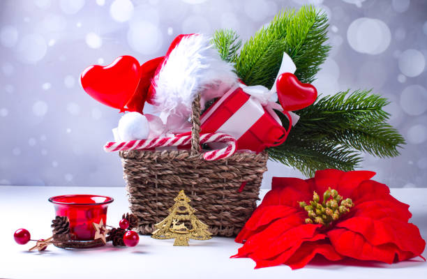 istock New Year gift basket. Green Christmas tree candy and gift boxes 1347688705