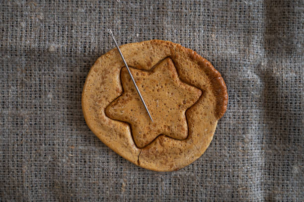 istock Brown sugar caramel candy cookies with a metal needle 1347691304