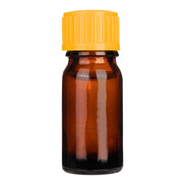 istock Amber color small pharma grade empty glass bottle with orange cap. 1347691733
