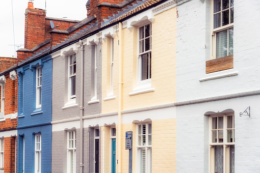 The colourful painted brick exteriors of terraced houses in the English town of Leamington Spa in Warwickshire.