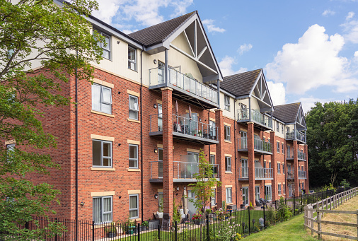 The exterior of a newly built block of flats north of London, with spacious balconies.