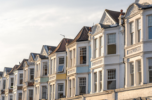 A row of Victorian terraced flats above shops in Muswell Hill, London.