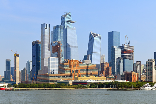 New York, NY, USA - June 4, 2022: Buildings in the World Trade Center complex, including One World Trade Center and St. Nicholas Greek Orthodox Church.