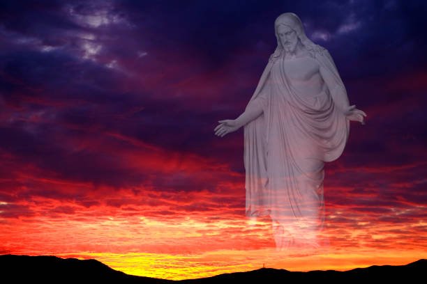 Sunset or sunrise on mountain range beautiful clouds colors twilight or dawn and Jesus as creator arms out love