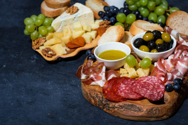 istock cold cuts, bread and cheese on wooden board, top view 1347695589