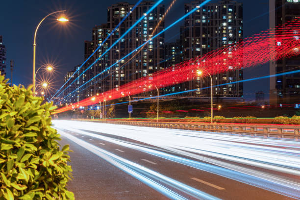 istock Modern city road car light trails 1347695799