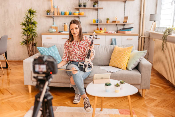istock Musician making a vlog playing violin 1347697317