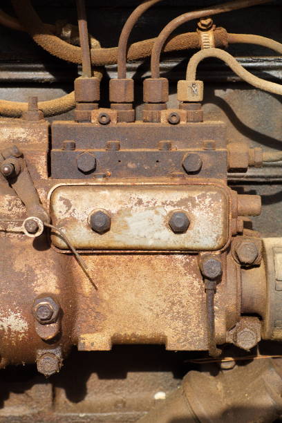 istock Old, dirty and polluting abandoned red tractor 1347699152