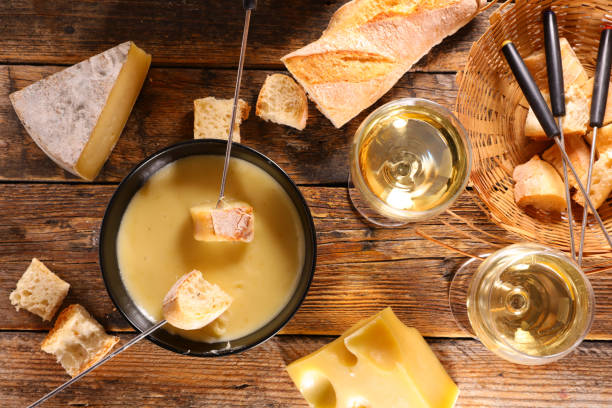 istock cheese fondue with baguette and wine 1347700013