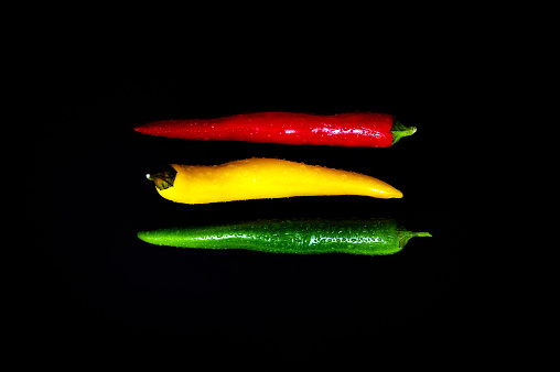 a hot peppers , beautiful background spices and condiments close up