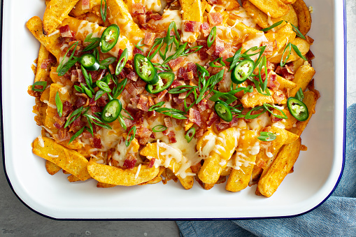 Cheese fries with bacon, jalapenos and green onions