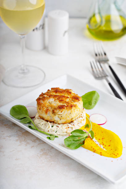 istock Gourmet plated fishcake with vegetables 1347703837