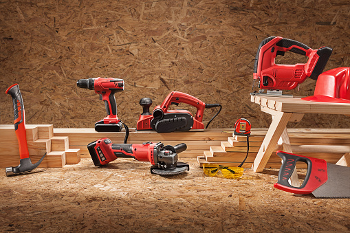 Set Of Working Tools. Electric Carpenter Hand Tools Set. On Plywood Background.