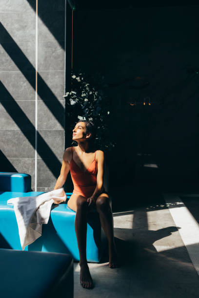 istock Beautiful Woman Resting after Swimming 1347704005