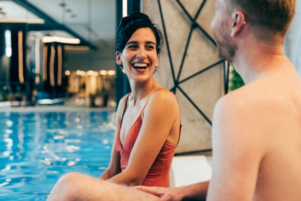 istock Happy Couple Having Fun at Swimming Pool 1347704009