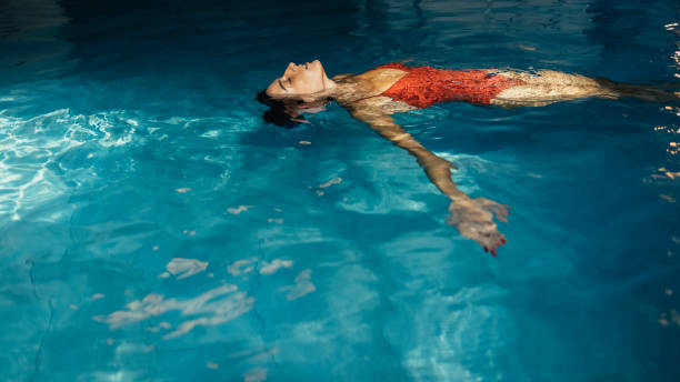 istock Young Woman Enjoying in Hotel Pool 1347704608