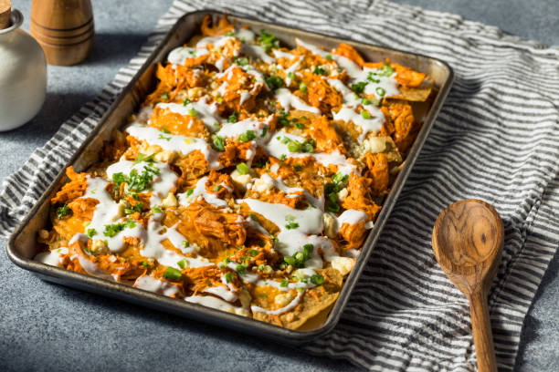 Homemade Buffalo Chicken Nachos with Ranch Homemade Buffalo Chicken Nachos with Ranch and Onions ranch dressing stock pictures, royalty-free photos & images