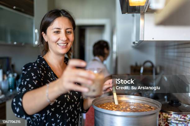 Adult Woman Is Cooking Ashura For The Whole Family In The Kitchen Stock Photo - Download Image Now