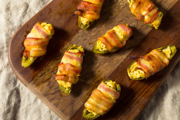 Homemade Bacon Wrapped Jalapeno Poppers Homemade Bacon Wrapped Jalapeno Poppers with Cream Cheese bacon wrapped stock pictures, royalty-free photos & images