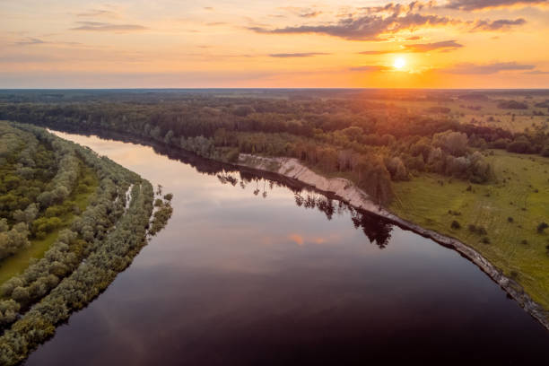 istock Drone photo of big river with setting sun on the background 1347706336