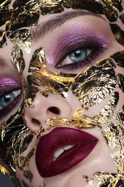 istock Beauty portrait with golden foil 1347708885