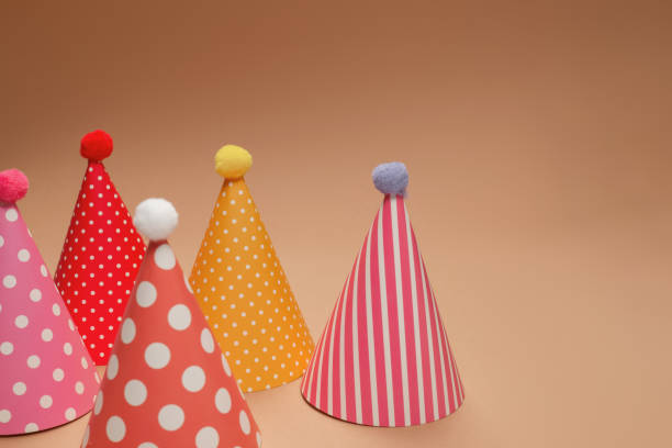 istock Colorful birthday cap on brown  background. 1347712480